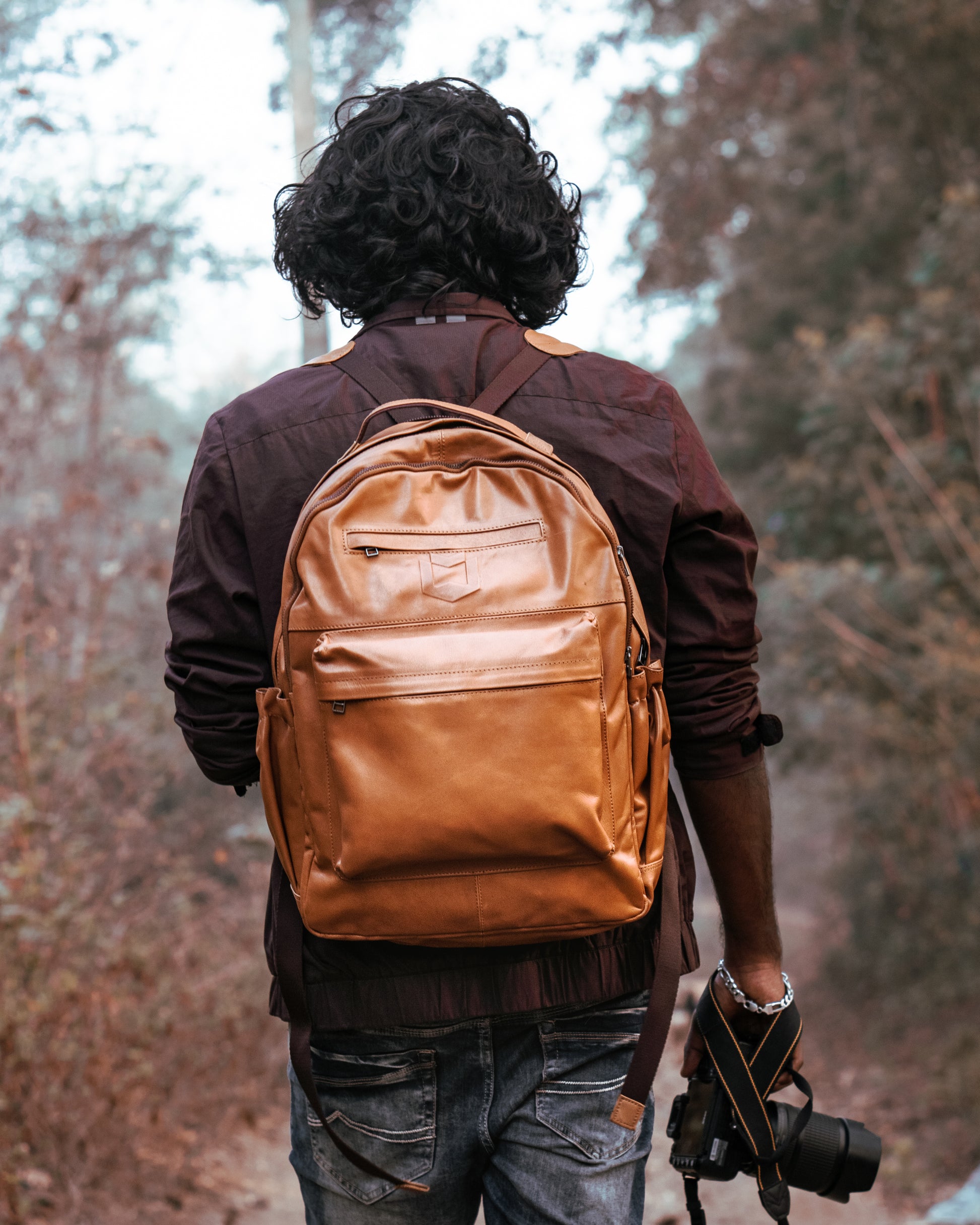 WM tan leather backpack